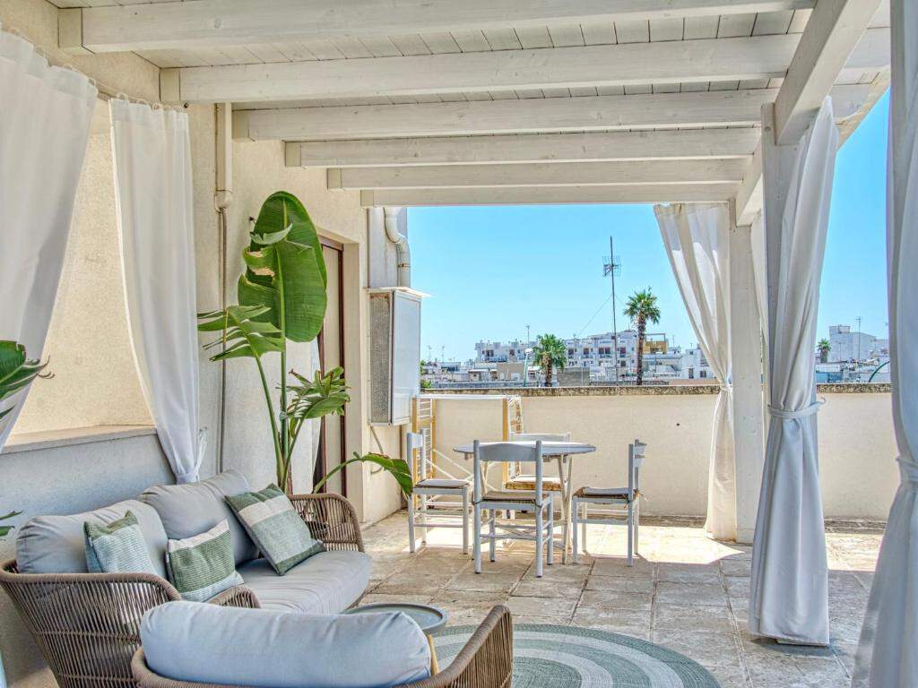 Rooftop terrace with sea and town view at Ideal Rooms